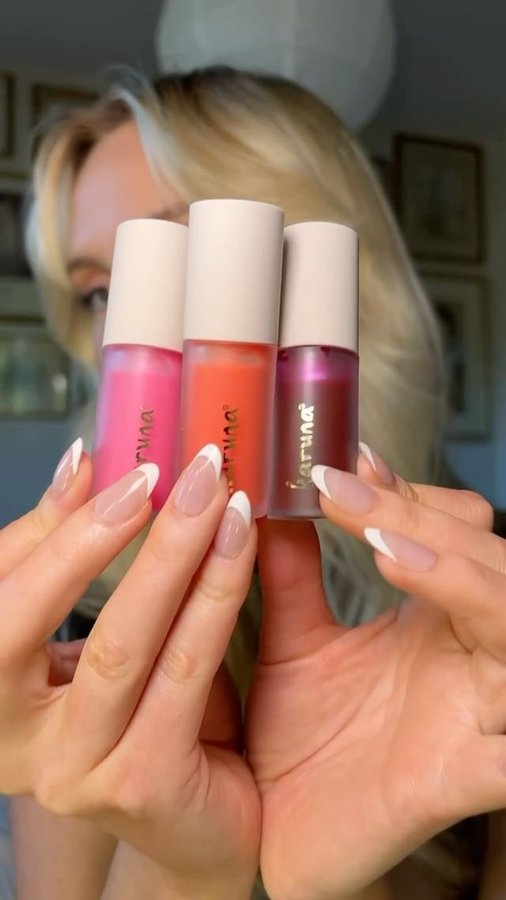 Instagram post by @annaannora_ for Karuna Skin. Caption reads: Lip oil packed with benefits! The Karuna Tinted....