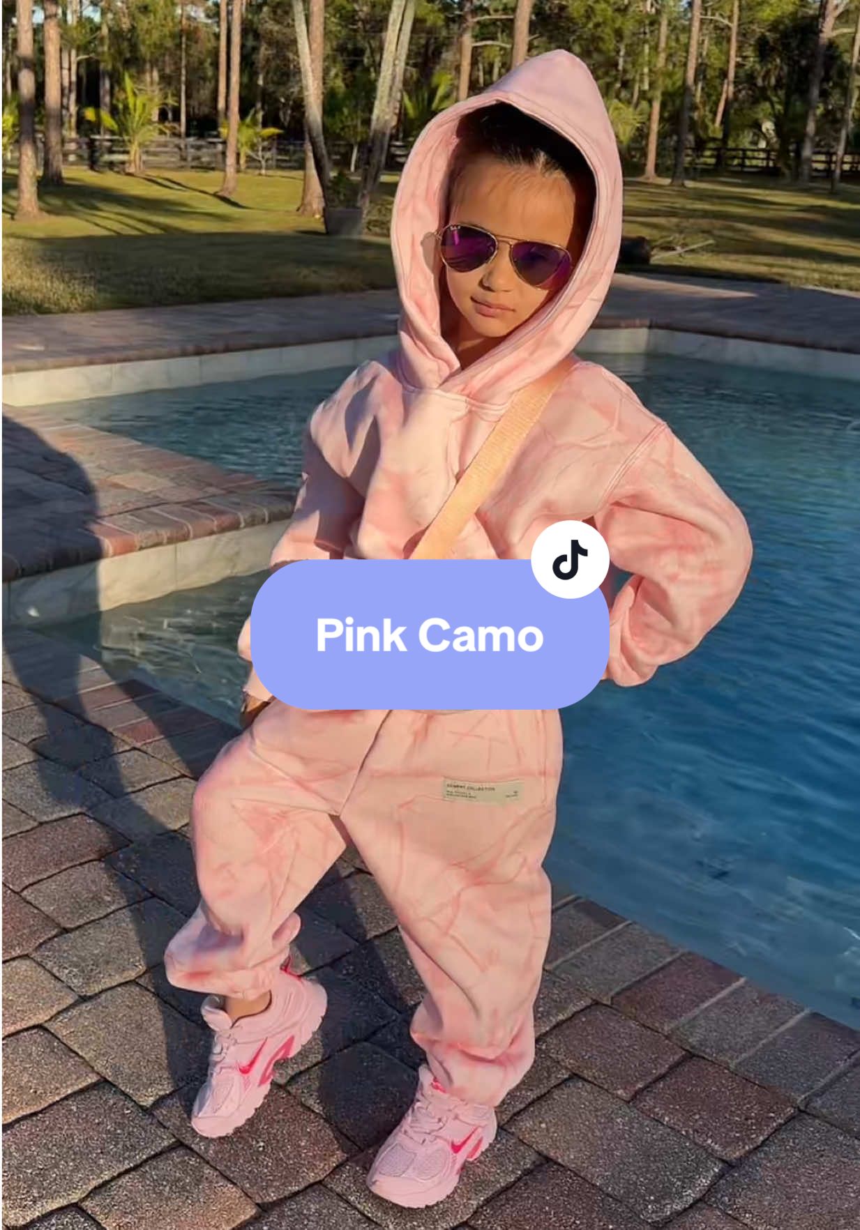 TikTok post by @thevisualshop for Comfrt. Caption reads: The Viral Camo Print now comes in PINK🩷....