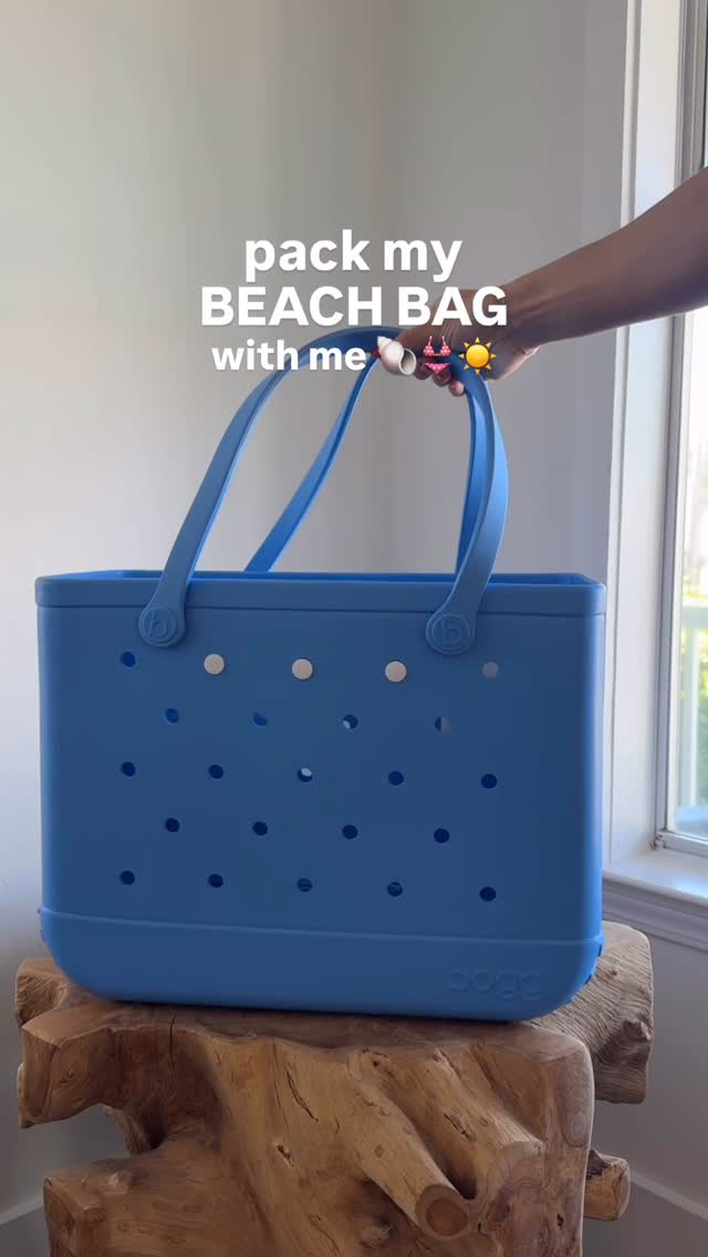Instagram post by @__balancedwithbritt for Harvest Snaps. Caption reads: beach bag essentials: ✔️ towels ✔️ SPF ✔️ beach....