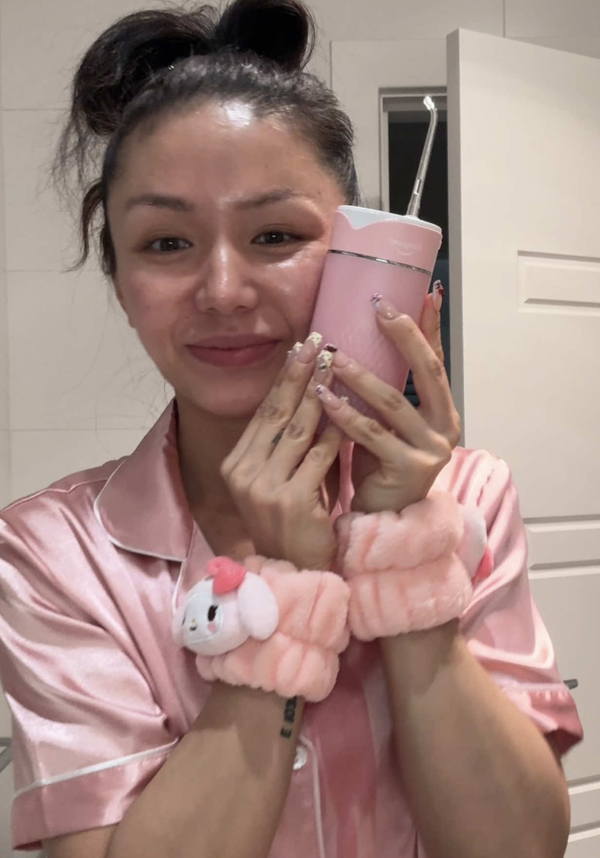 TikTok post by @sliang95 for Colgate. Caption reads: You can grab my @Colgate Australia pink water....