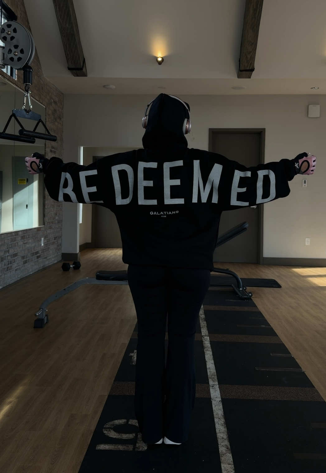 TikTok post by @mskellycastrro for God's Love Overcomes. Caption reads: Wearing this hoodie for a better workout🤍 @God’s....