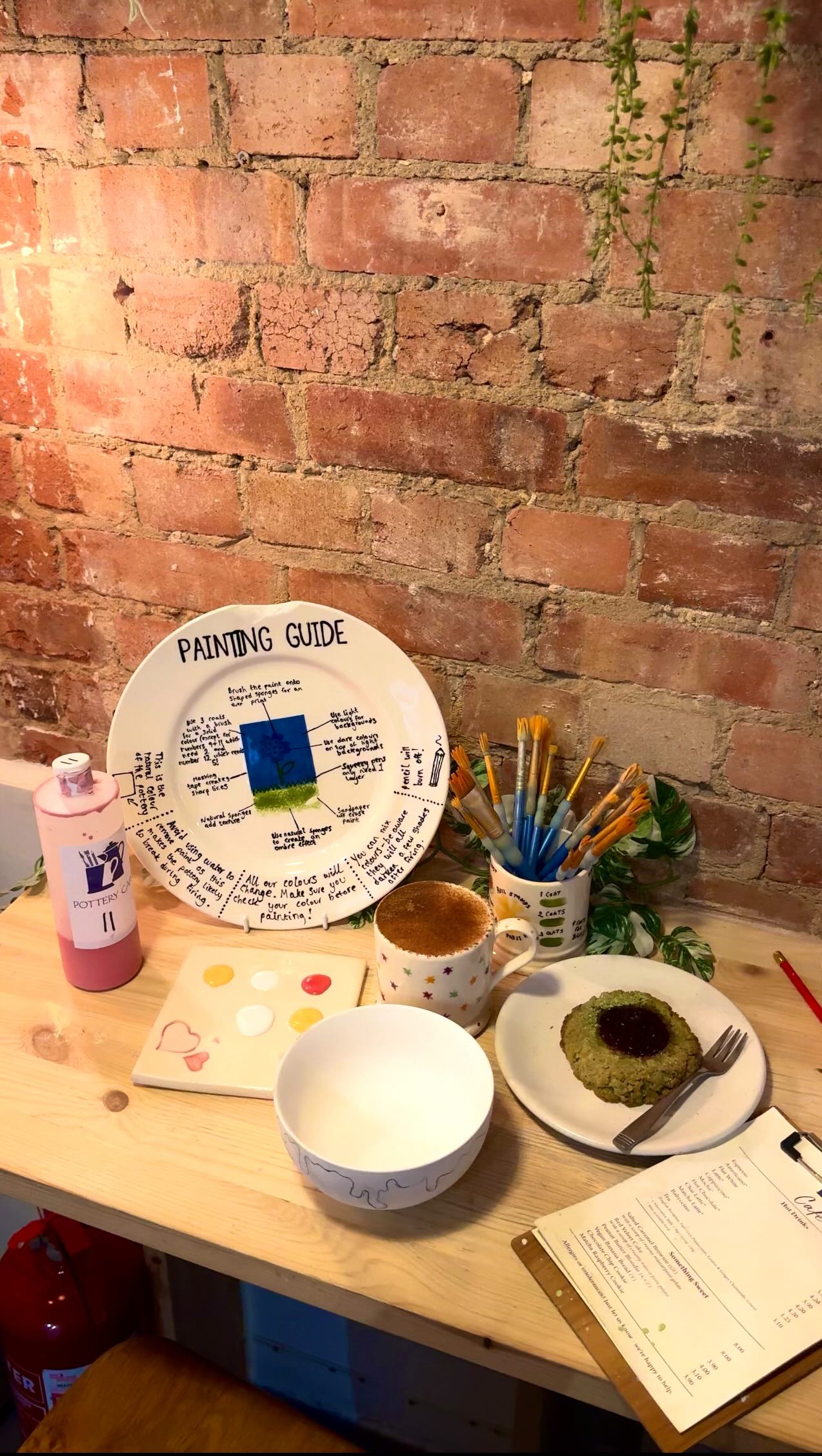 Instagram post by @feast.n.treats for Pottery Café. Caption reads: @pottery_cafe | 📍Fulham rd, SW6 💌INVITE | AD....