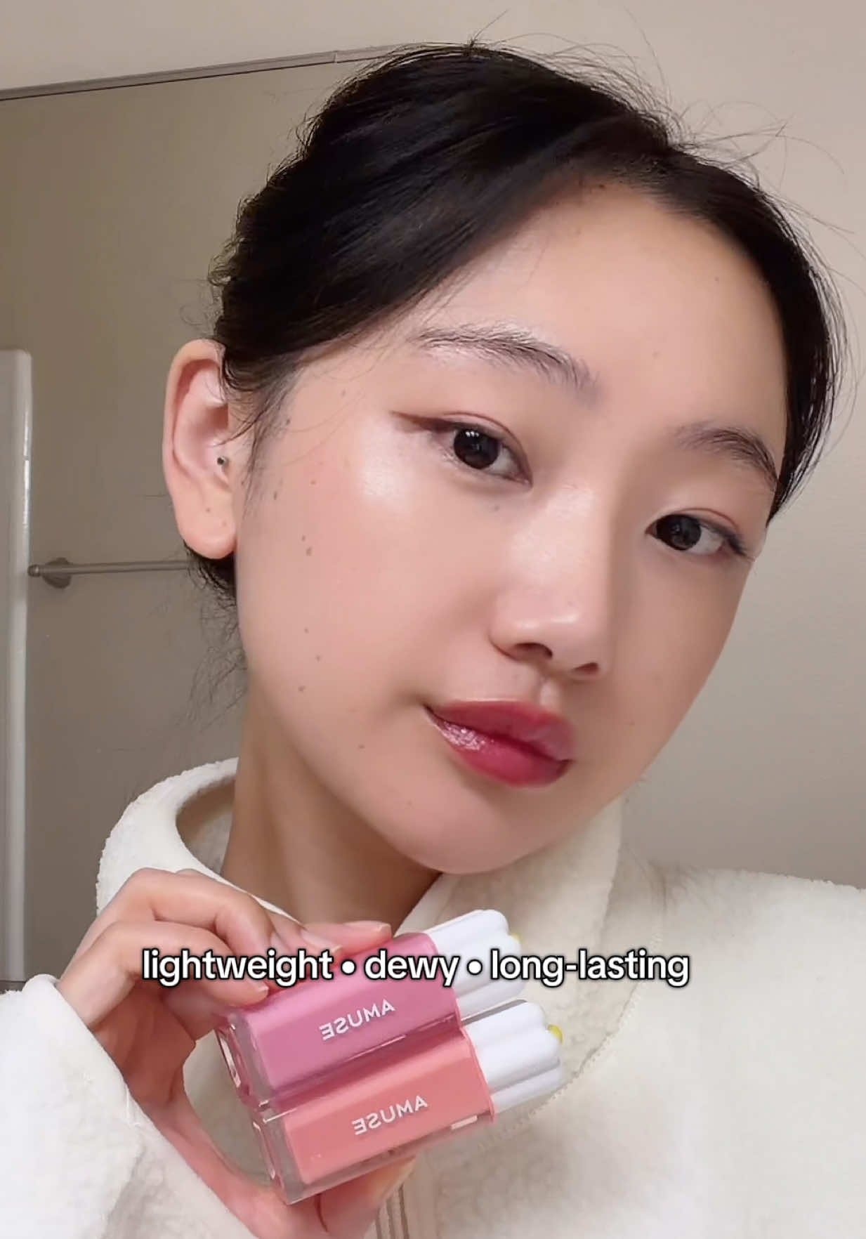TikTok post by @tshomodrakpa for AMUSE Seoul. Caption reads: [...] 🍇✨ Which shade you picking?🫵🏻💄💋 @AMUSE....