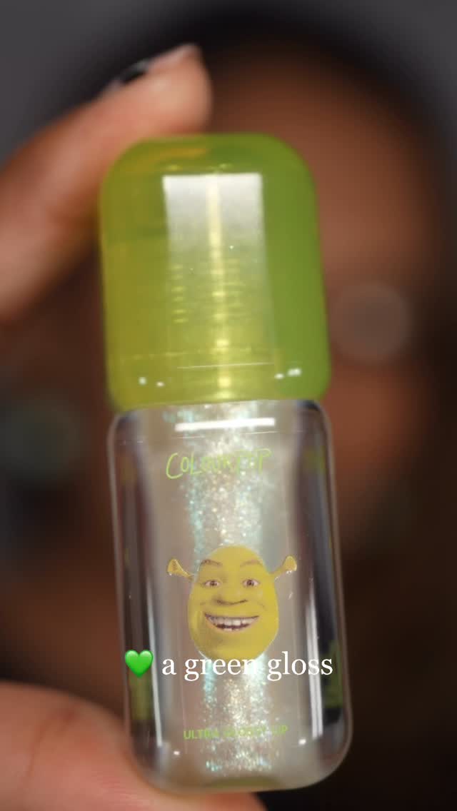 Instagram post by @glamsmitty for ColourPop Cosmetics. Caption reads: 💚 a green gloss

The Ogre gloss from the....