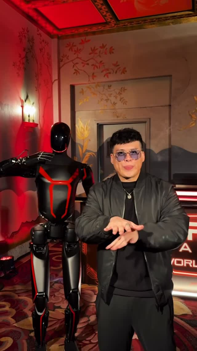 Instagram post by @iamspencerx for Tesla. Caption reads: Optimus robot dances to my beatbox 🗣️🎶🤖.