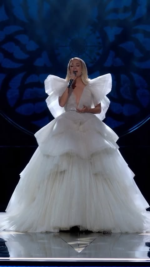 Instagram post by @carrieunderwood for Max. Caption reads: Get into the holiday spirit with this performance....