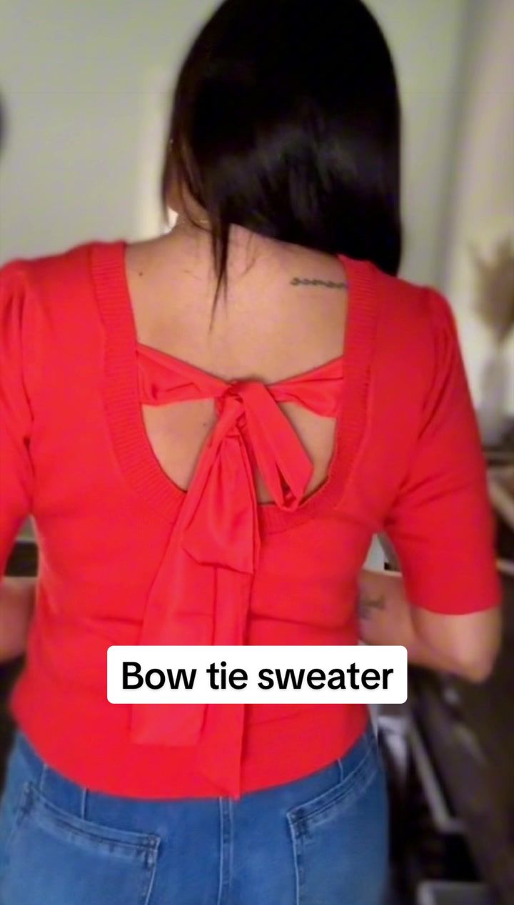 TikTok post by @katabild for OmmigO. Caption reads: The bowtie on the back of this sweater is darling!....