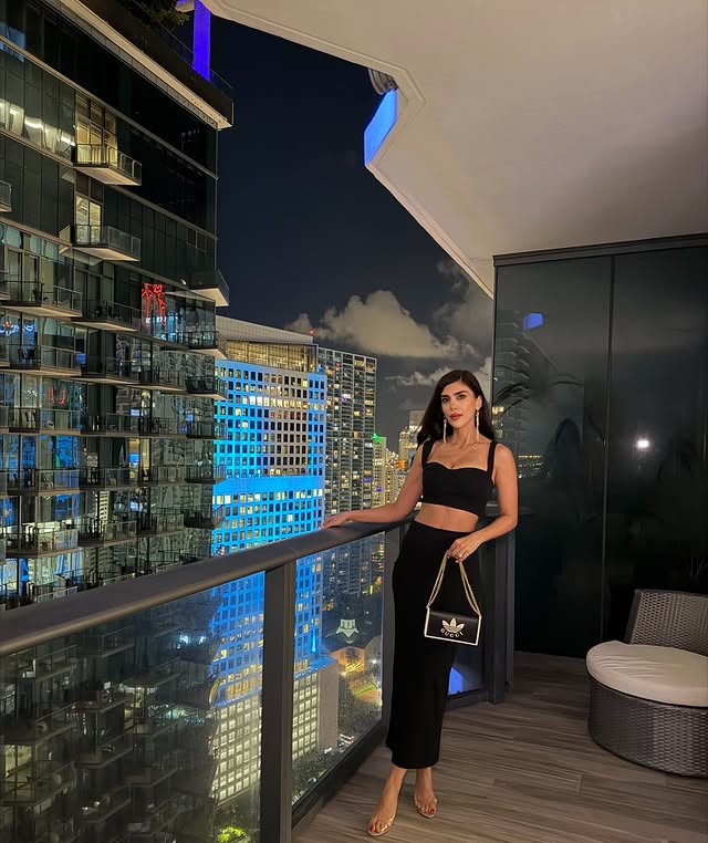Instagram post by an influencer for REVOLVE. Caption reads: [...] two-piece, Miami mood 🌙🖤 @revolve....