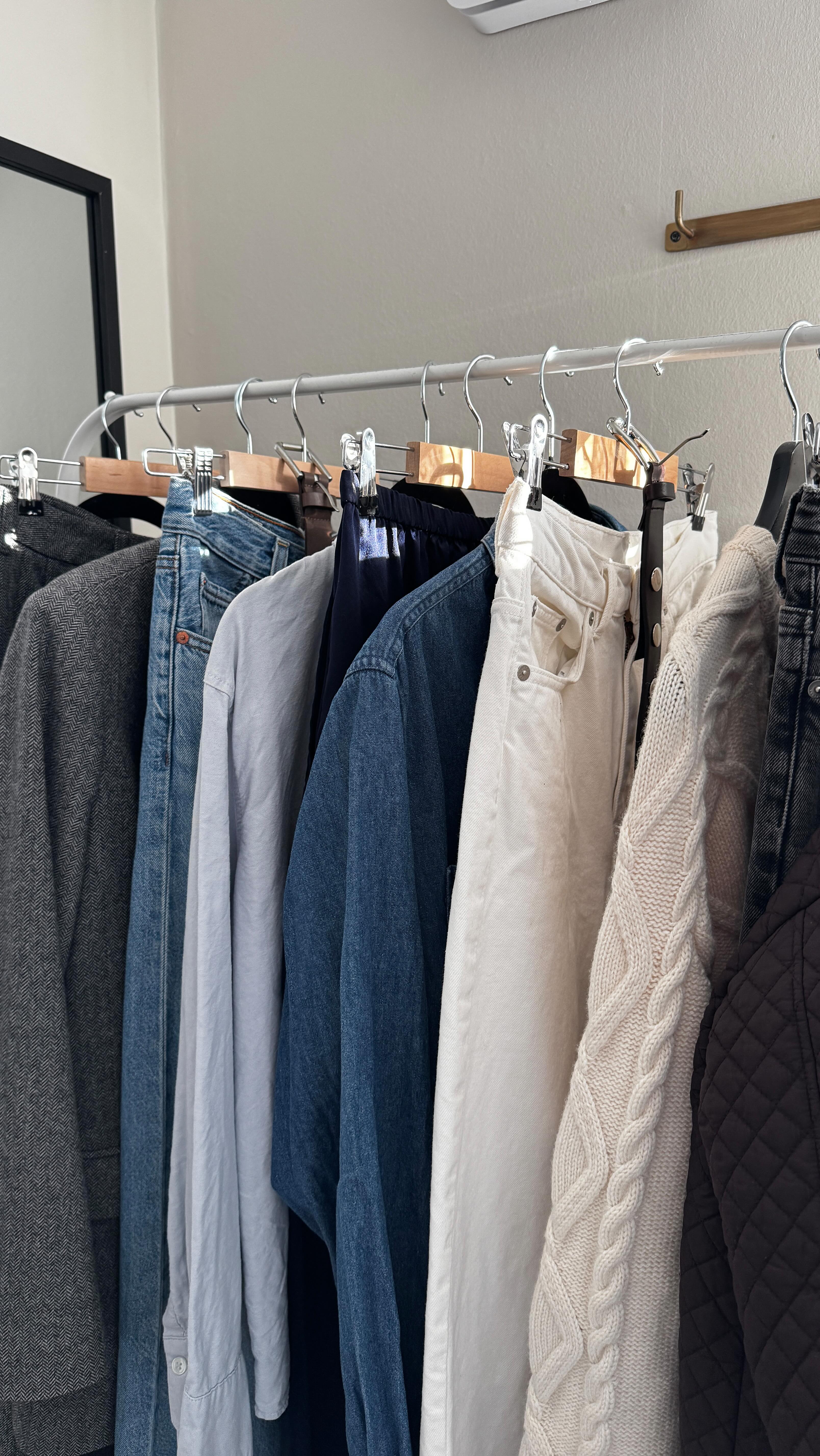 Instagram post by @useless_dk for Shaping New Tomorrow. Caption reads: [...] items featured grey trousers....