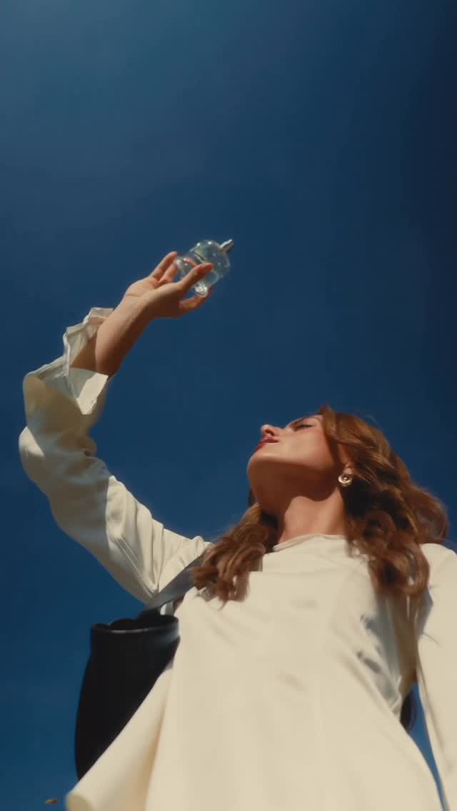 Instagram post by @madie for JIL SANDER. Caption reads: Perfume has the power to pause time. In the rush....