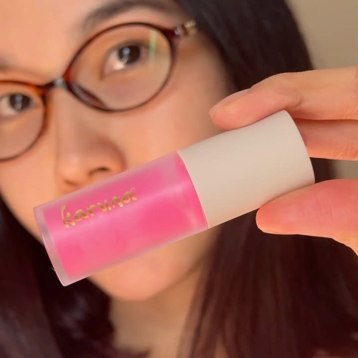 Instagram post by @smailovas for Karuna Skin. Caption reads: [...] Color ✨ Nourish and enhance your lips with....