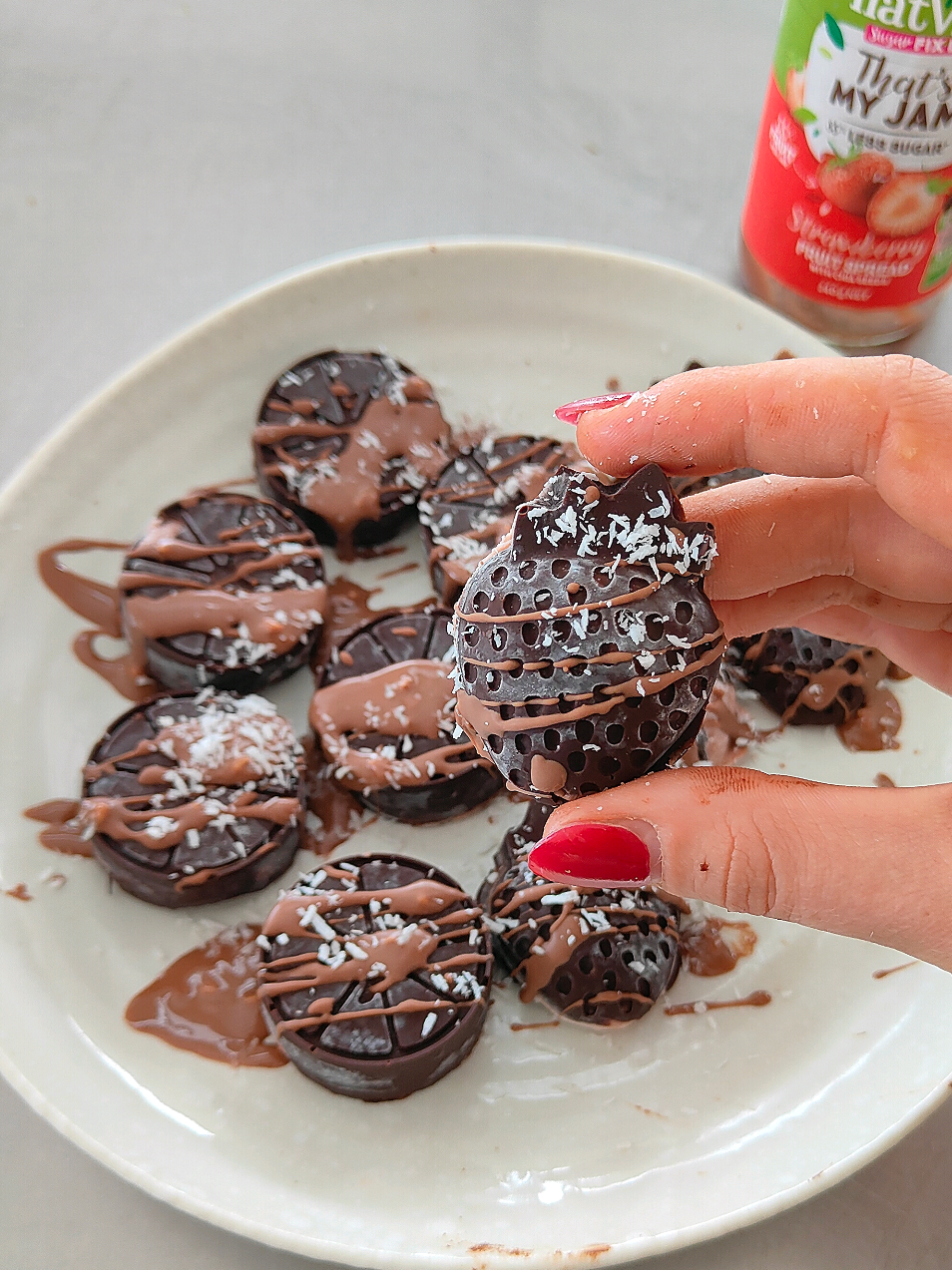 TikTok post by @jemmasbalance_ for Natvia. Caption reads: 2 ingredient chocolate jam bites 🍓🍫 These are....