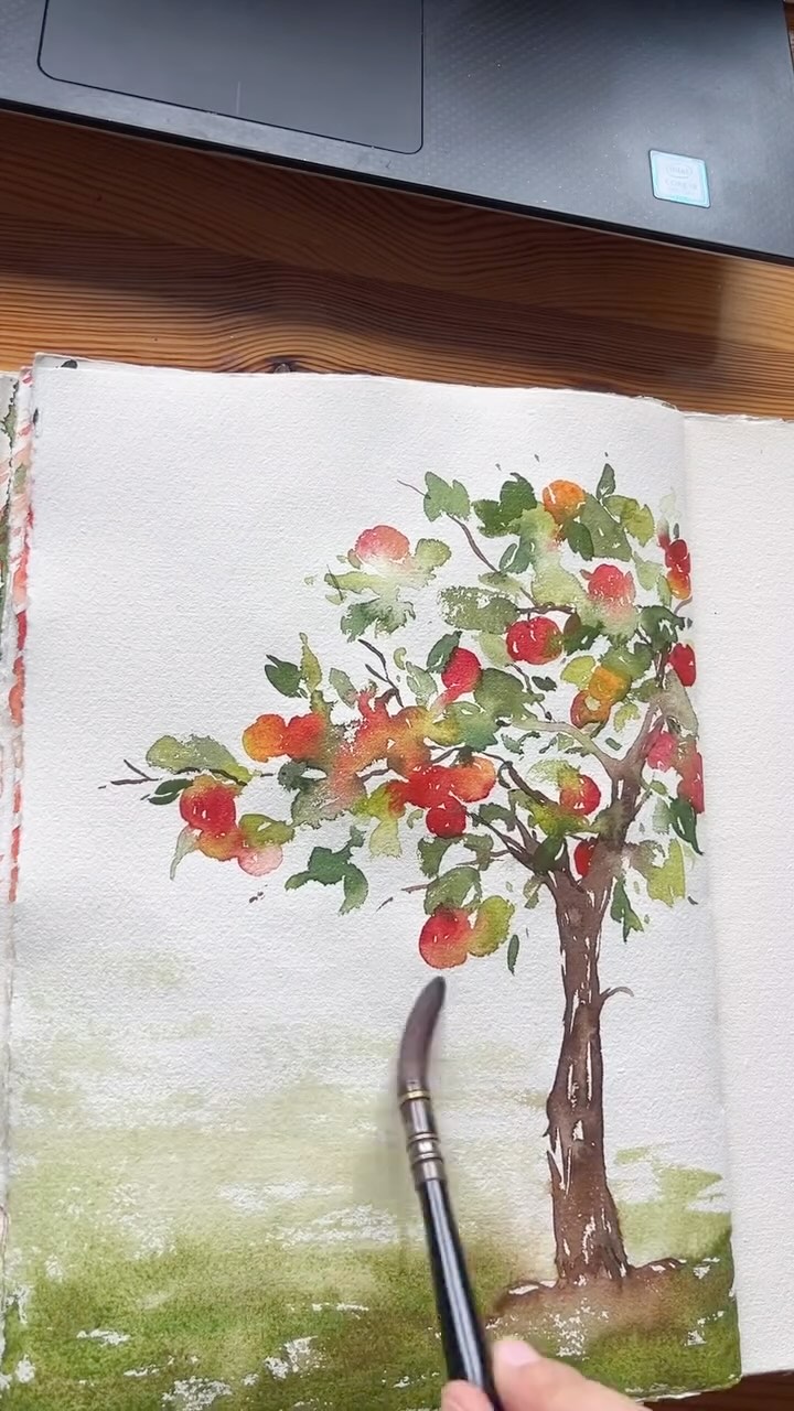 Instagram post by @jolapictures for Kuretake ZIG. Caption reads: paint an apple tree with me🍎! there are so many....