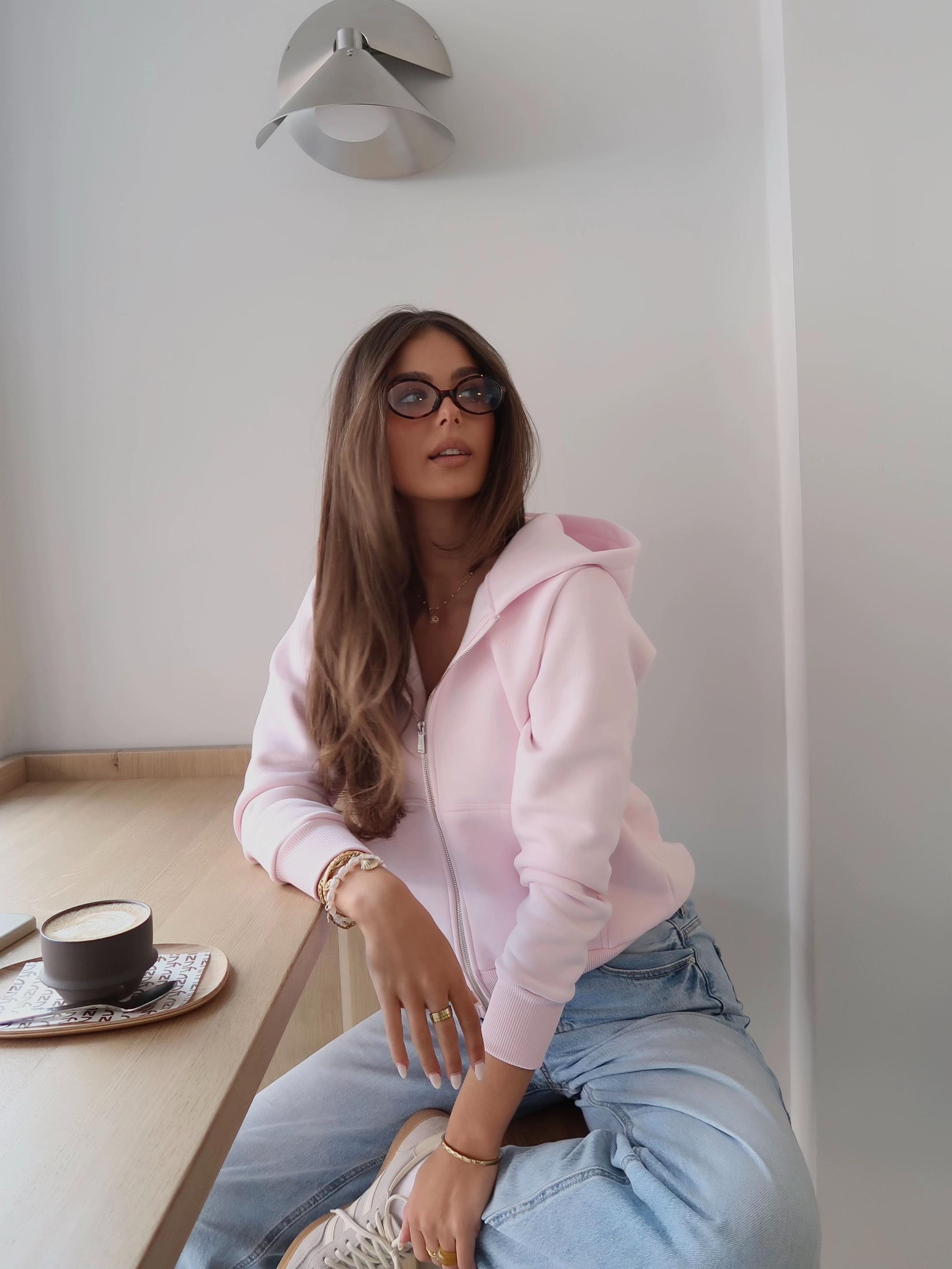 TikTok post by @jule.thi for Caspara Sports. Caption reads: Anzeige | wearing @CASPARA 🧸 #caspara #hoodie....