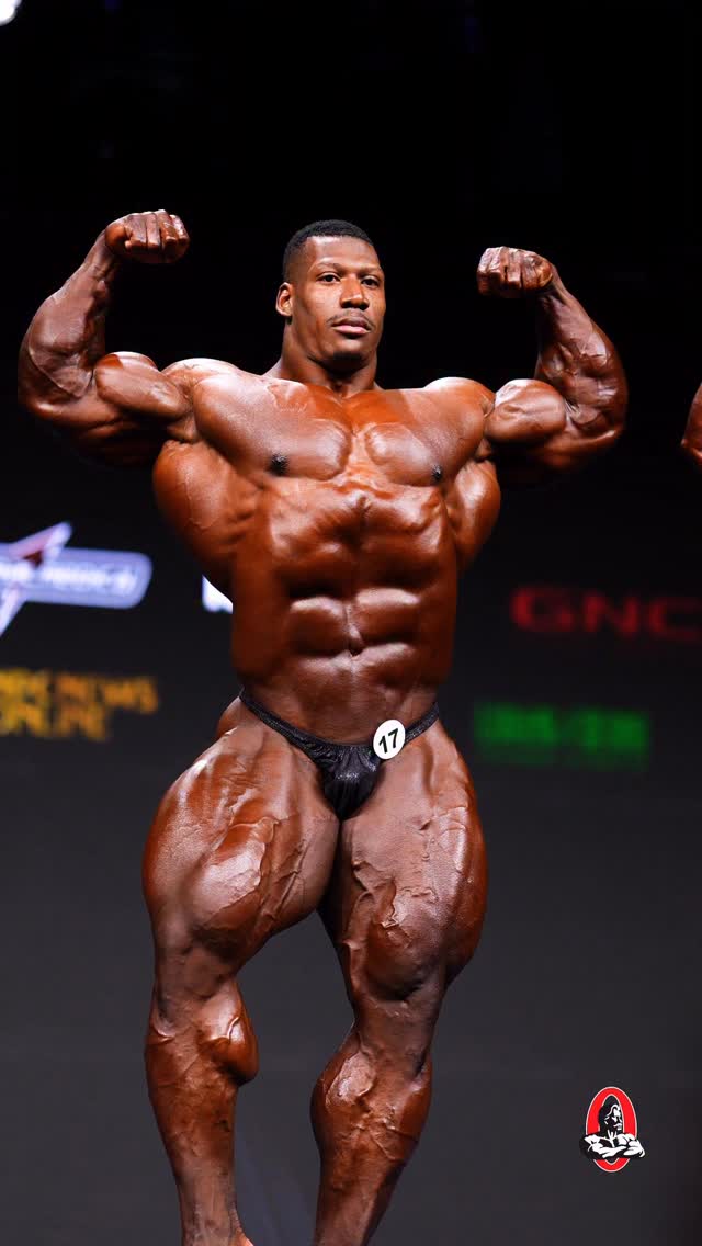 Instagram post by @neckzilla.official for FLEX Magazine. Caption reads: 2025  Mr.Olympia 

Athlete: @neckzilla.official....