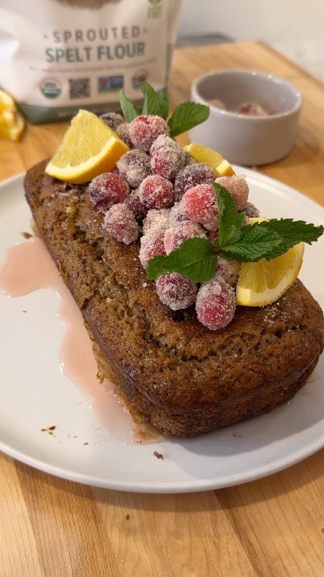 Instagram post by @chefpriyanka for One Degree Organics. Caption reads: ORANGE LOAF WITH CANDIED CRANBERRIES MADE WITH....