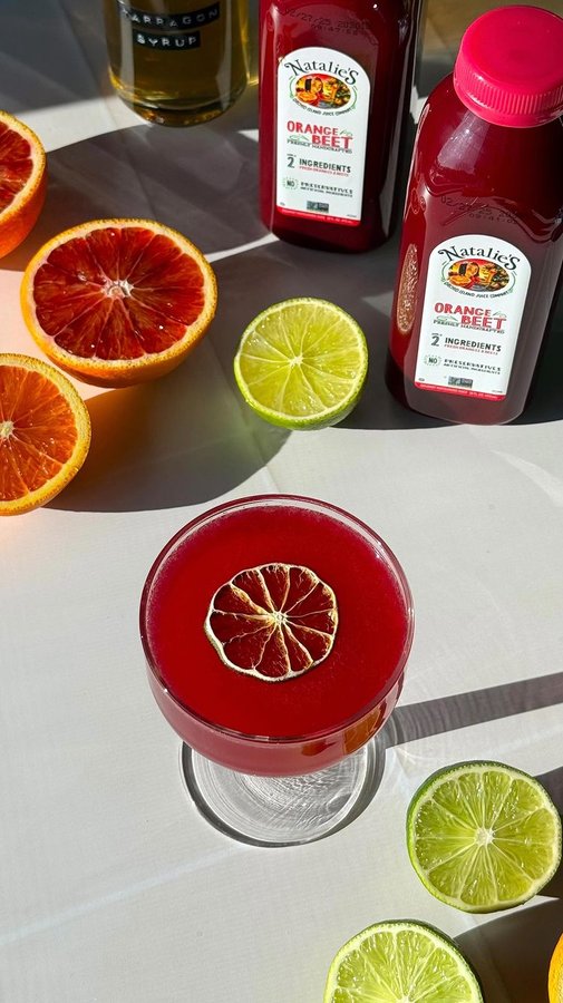 Instagram post by @drinksbyevie for Natalie's Orchid Island Juice. Caption reads: #NataliesOJPartner Valentine’s day is right around....