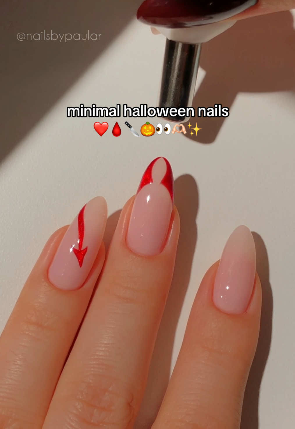TikTok post by @nailsbypaular for MelodySusie. Caption reads: minimal halloween nails! ❤️🩸🔪 a red cat eye....