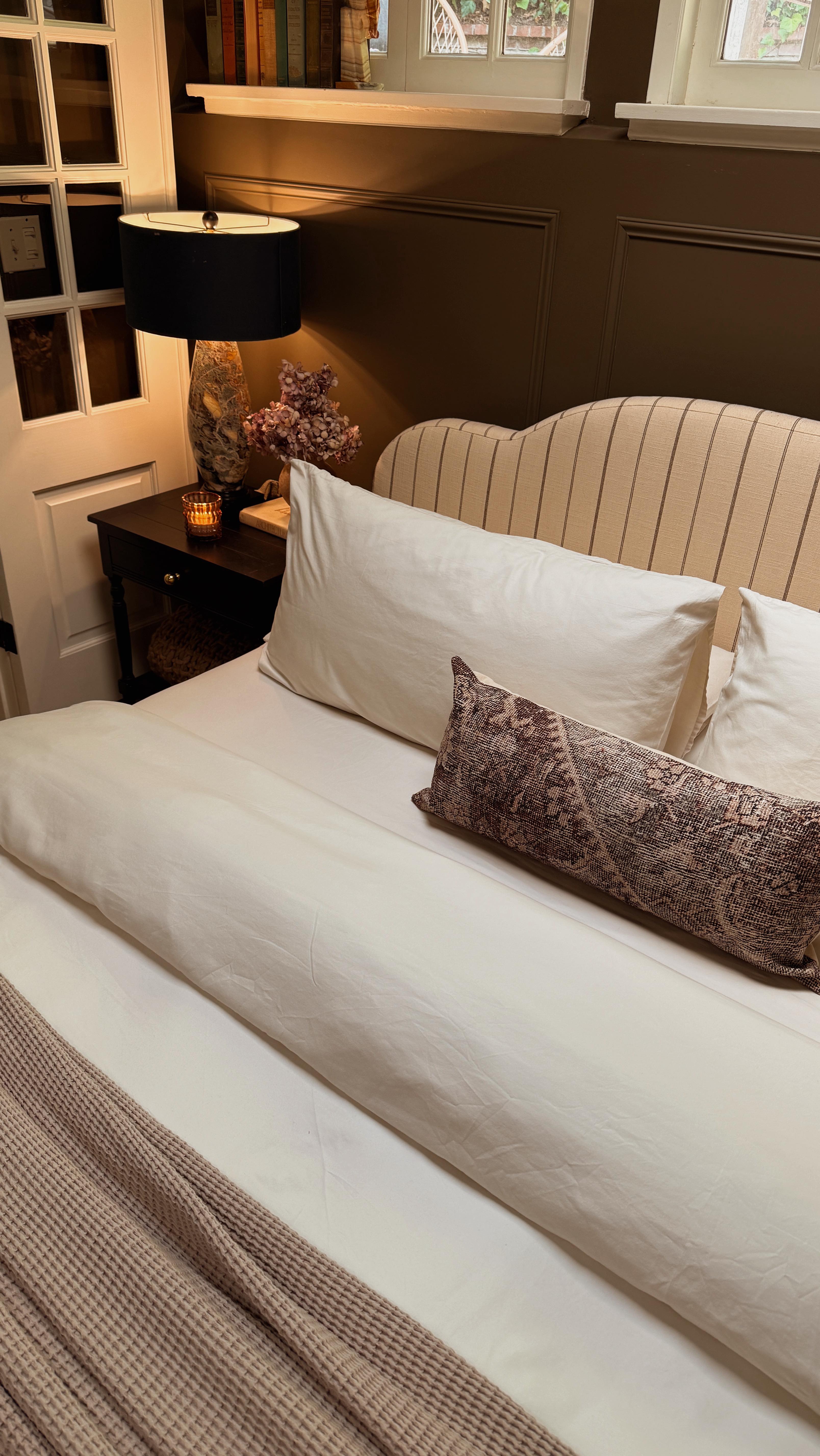 Instagram post by @xomacenna for Brooklinen. Caption reads: From calm mornings to cozy nights ✨ #ad Our....