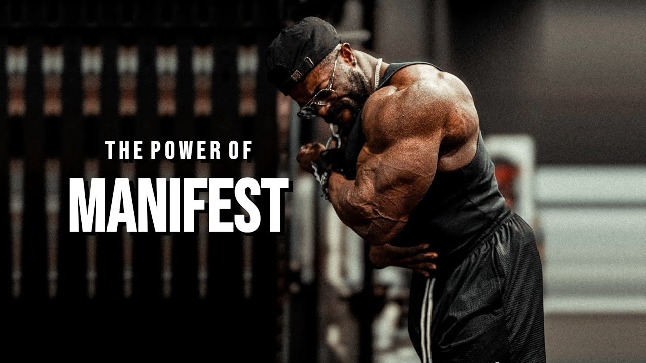 YouTube post by @MuscleBrawn for ENHANCED Labs. Caption reads: THE POWER OF MANIFESTATION 💫 Gym Motivation.