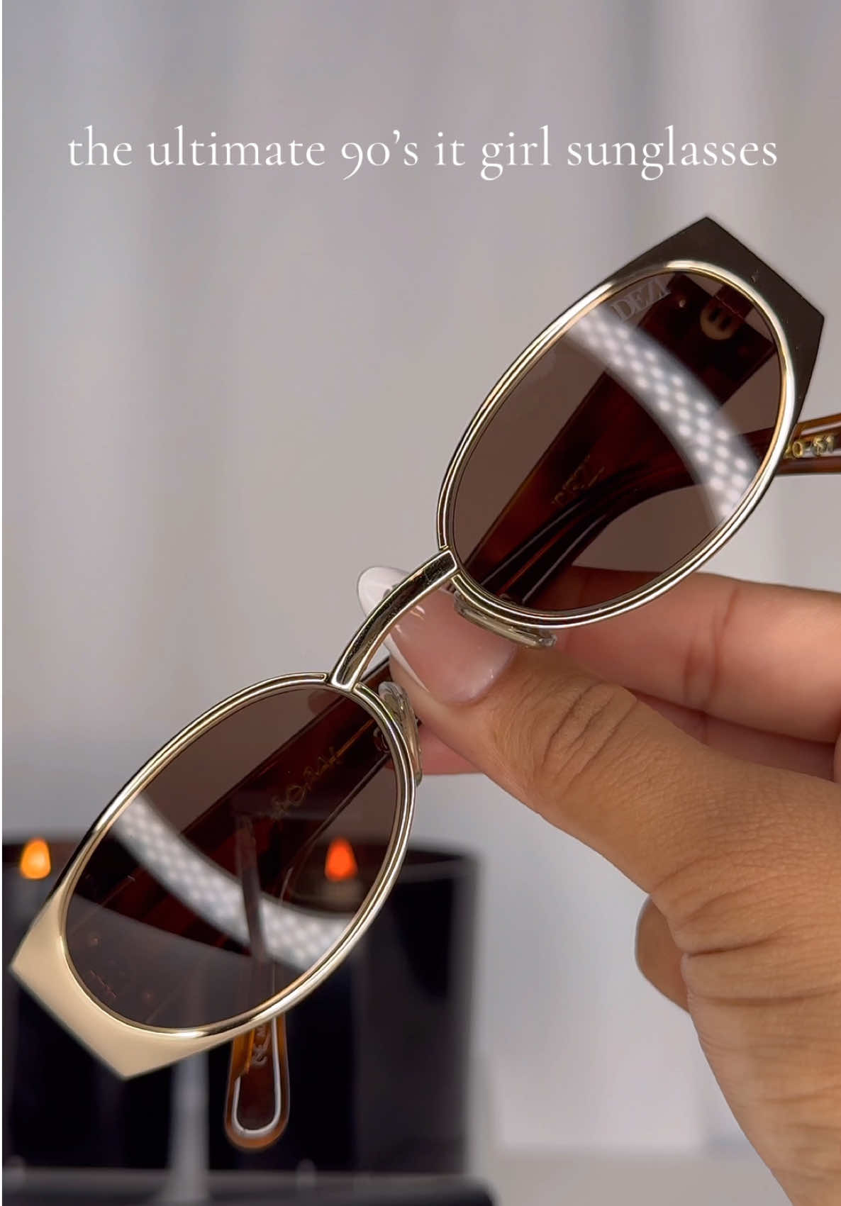 TikTok post by @erensnchz for DEZI. Caption reads: NAOMI by @DEZI EYEWEAR gives pure 90’s it-girl....