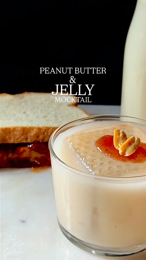 Instagram post by @marvelousmixing for Almond Cow. Caption reads: PB&J, but make it a mocktail! I used my Almond Cow....