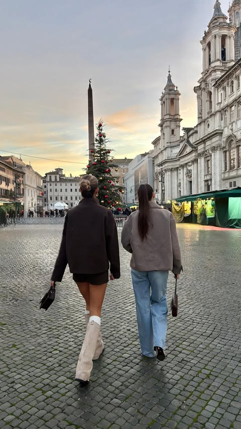 Instagram post by @erikaidras for En Route Jewelry. Caption reads: GRWM *airport edition* ✈️
• Tracksuit: @drmersclub....