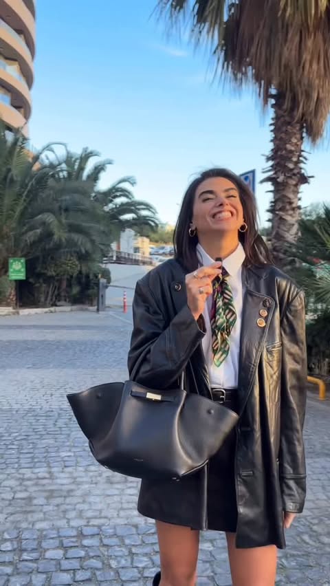 Instagram post by an influencer for DeMellier. Caption reads: [...] Belt & boots @mango Bag @demellierlondon.
