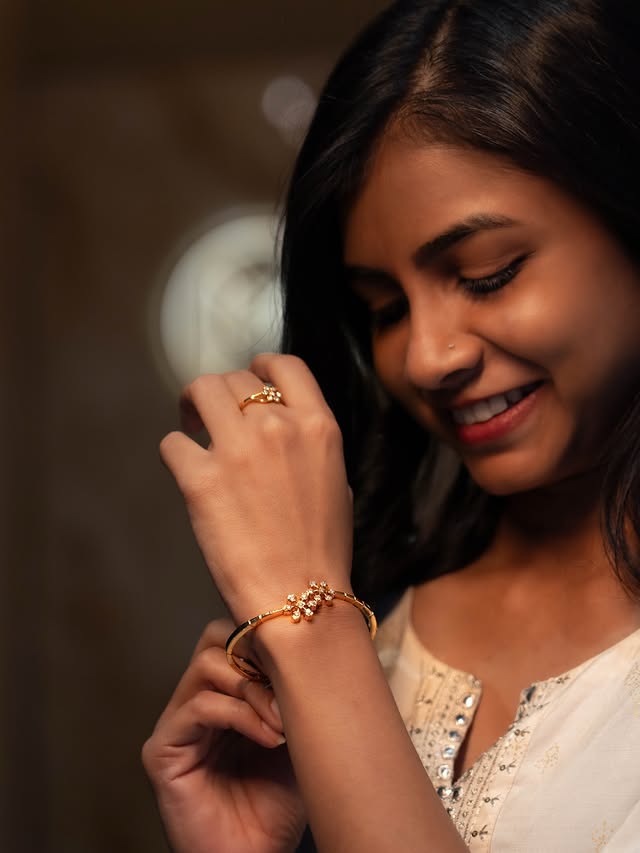 Instagram post by @darshini_j_ for Malabar Gold and Diamonds. Caption reads: Golden glow, diamond dreams ✨💛 With Malabar Gold....
