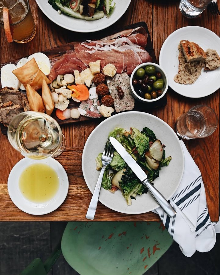 Instagram post by @bucketlistboston for Interior Design. Caption reads: #1126 Escape the Boston cold & lunch @terraboston....