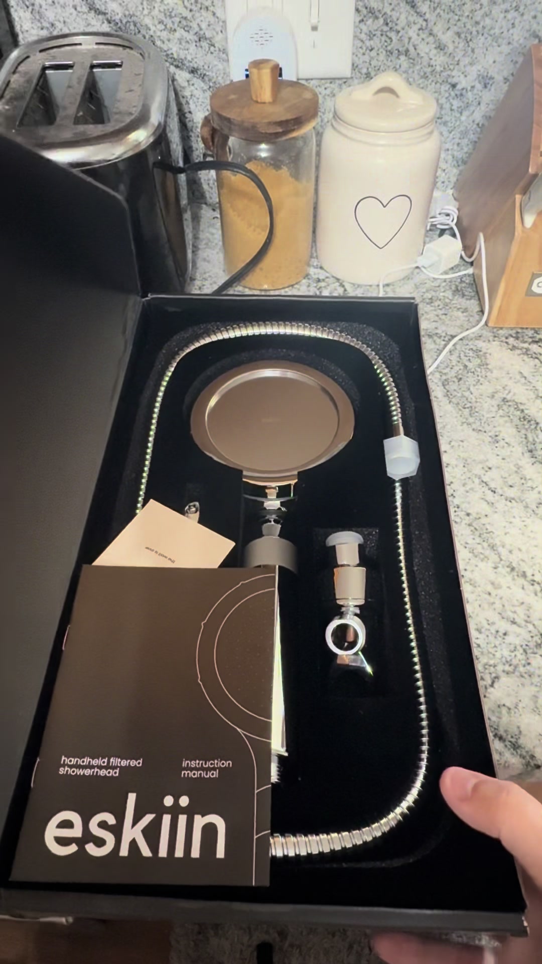 TikTok post by @lizziebodizzie for Eskiin. Caption reads: @eskiin #shower #showerhead #bathroomupgrade [...].