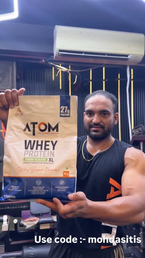 Instagram post by an influencer for Atom by AS-IT-IS. Caption reads: Atom whey protein XL Dubai Kunafa use code extra....