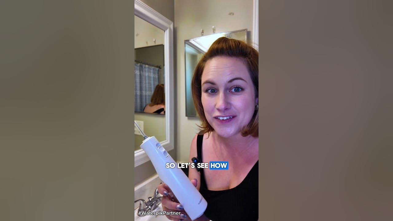 YouTube post by @waterpik for Waterpik. Caption reads: #Ad | Improve Your Gum Health With Waterpik....
