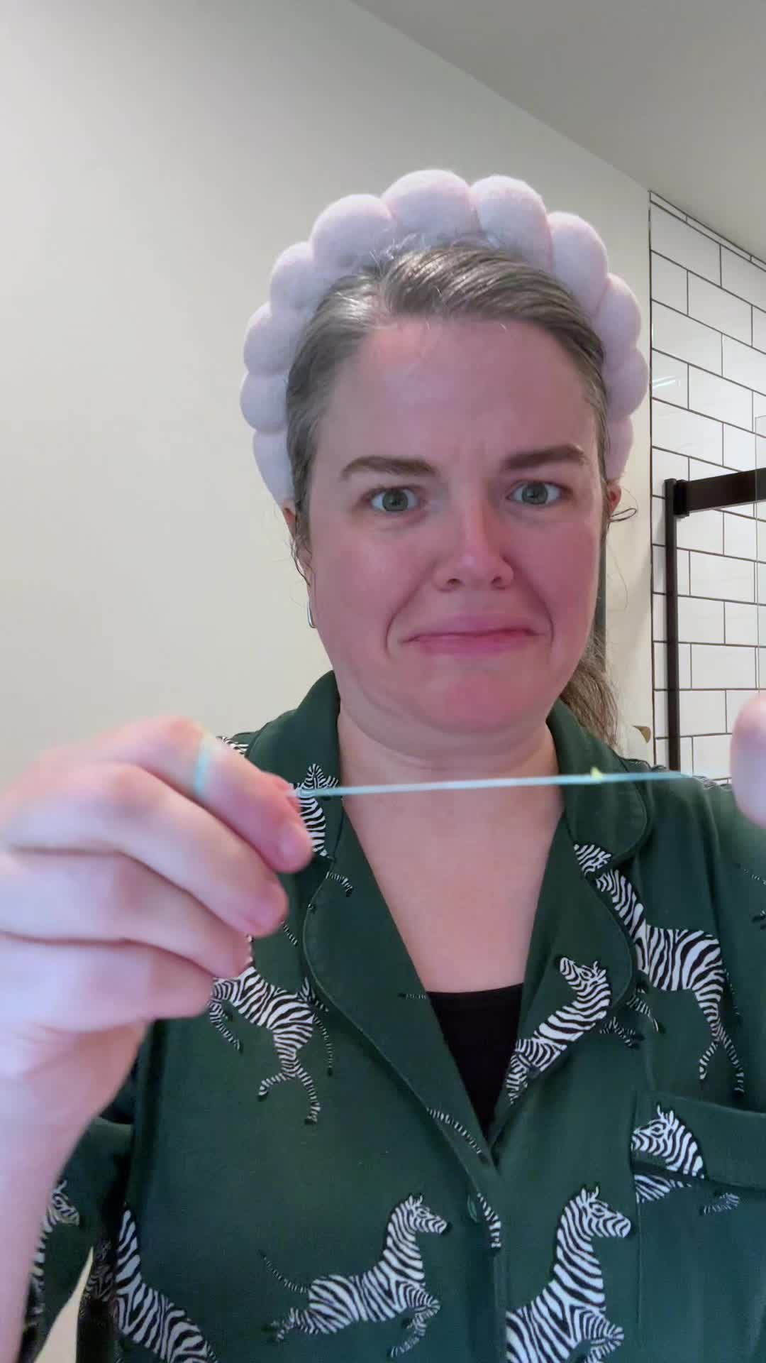 TikTok post by @leah_lovesit for Cocofloss. Caption reads: My floss matches my vibe now and I love that it is....
