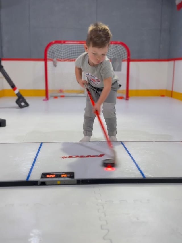 Instagram post by @connormacdangles for HockeyShot. Caption reads: [...] in the basement 🏒🙌🎄#superdeker....