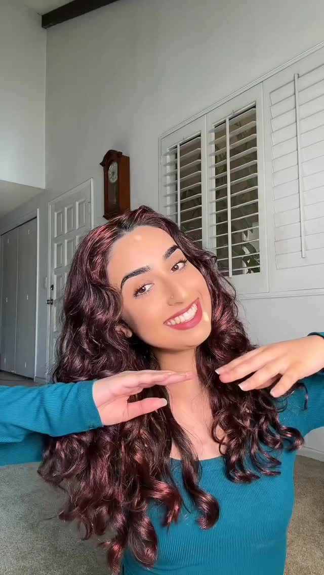 Instagram post by @sumans.waves for CURLSMITH. Caption reads: jk it’s temporary dye BUT…I’m tempted......