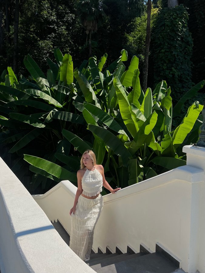 Instagram post by @kristio13 for JardinVue. Caption reads: [...] in this stunning white outfit from....