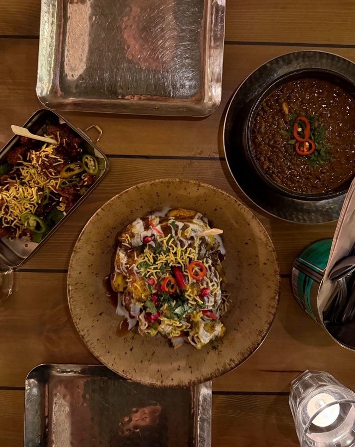 Instagram post by @capturing_the_kellys for Mowgli Street Food. Caption reads: ✨ pr| A night of flavour and warmth at....