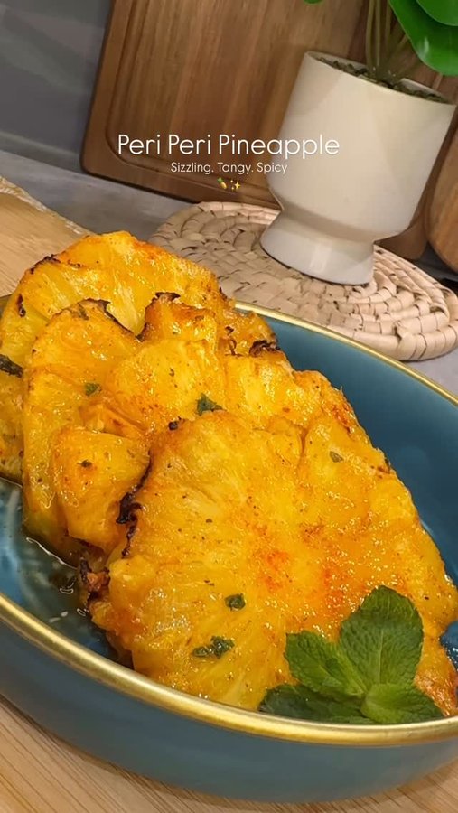 Instagram post by @saucyy_spoon for Swan Brand. Caption reads: PERI-PERI CHARRED PINEAPPLE 🍍🌶️🍋
Flavourful,....