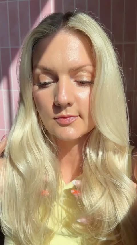 Instagram post by @ausradun for Gisou. Caption reads: [...] the secret to glossy summer hair 🌺🍯💗....
