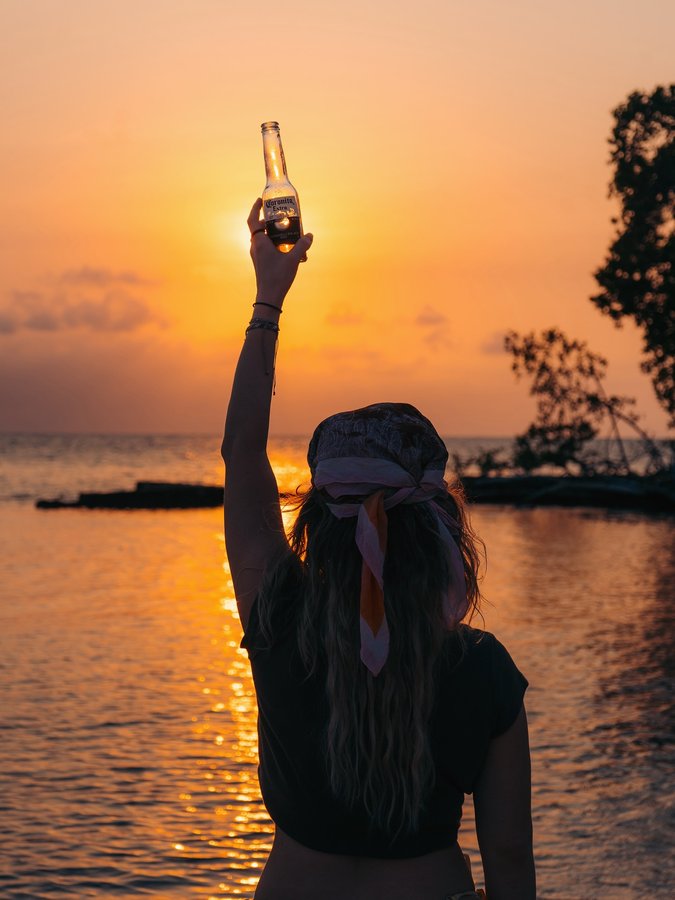 Instagram post by @makilllla for Corona. Caption reads: “6 days on @corona.island_ ” vlog is up on YouTube....