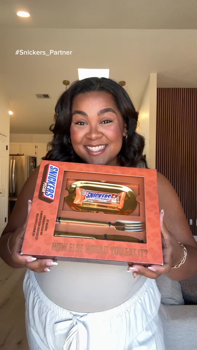 Instagram post by @mayadannie for Snickers. Caption reads: #Snickers_Partner When classic meets ICONIC 🧡🍫....