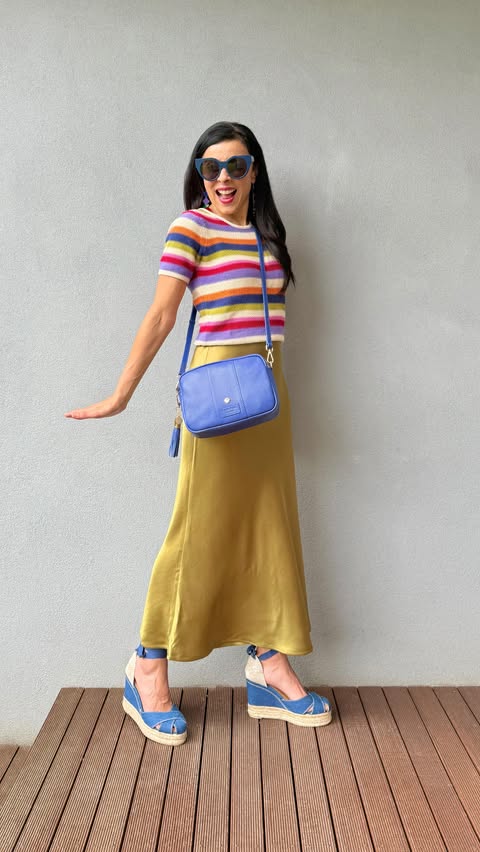 Instagram post by @dreams.of.colour for Pom Pom London. Caption reads: Jewel tone stripes teamed with shimmery green-gold....