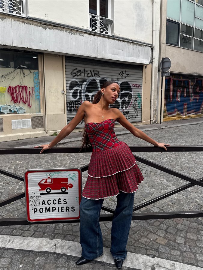 Instagram post by @elisasgn for Tommy Jeans. Caption reads: A little commotion for the dress @tommyjeans !....