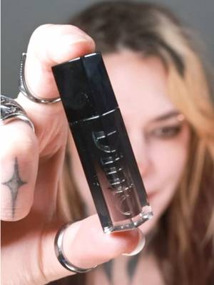 TikTok post by @courtneyquarantine for Dinto Cosmetics. Caption reads: we need more moody lip tints 👏 @Dinto Cosmetics....