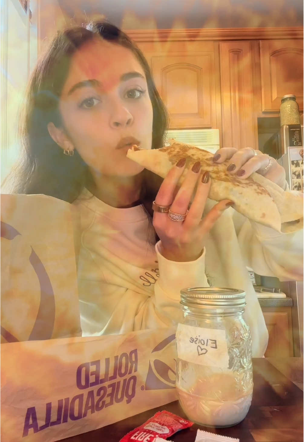 TikTok post by @okaycoolgigi for Taco Bell. Caption reads: savoring every last poblano moment with eloise....