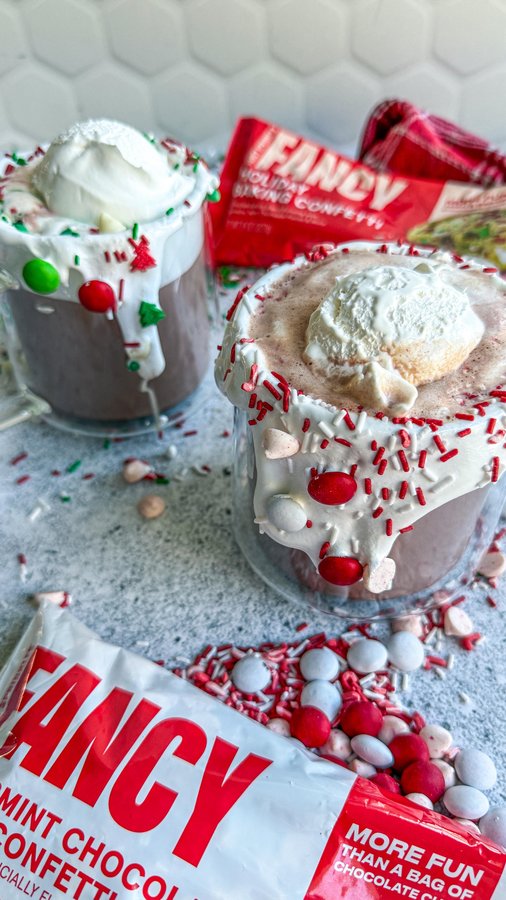 Instagram post by @makefoodlovely for Fancy Sprinkles. Caption reads: ☕️ 🍫 FANCY HOT CHOCOLATE 🍫 ☕️ 

This holiday....
