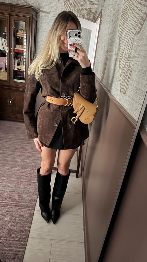 Instagram post by @amandalynrose for JustFab. Caption reads: Just a girl and her boots 
#justfabstyle....