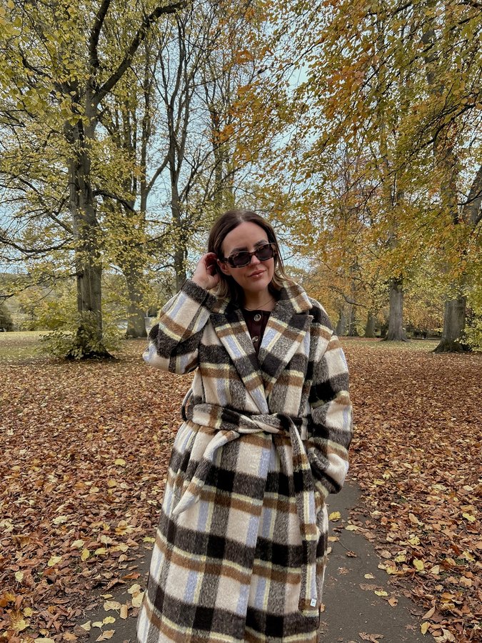 Instagram post by @mrsleonieholland for French Connection. Caption reads: [...] with coats should be studied....