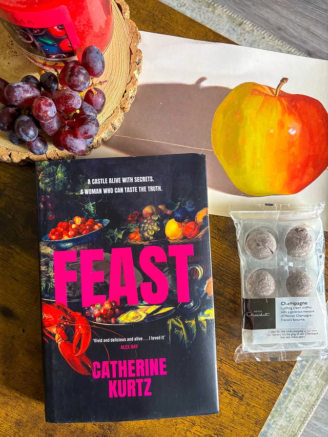 Instagram post by @bookishreadsandme for Berkley Publishing Group. Caption reads: FEAST 🍇 [ad-pr] ‘Feast is a sumptuous historical....